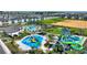 Aerial view of community pool, water park, and residential buildings at 1457 Olympic Club Blvd, Champions Gate, FL 33896