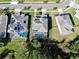 Aerial view of homes with solar panels and pools at 1457 Olympic Club Blvd, Champions Gate, FL 33896