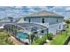 House with pool and solar panels; backyard view at 1457 Olympic Club Blvd, Champions Gate, FL 33896