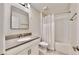 Clean bathroom with tub shower combo and white vanity at 1457 Olympic Club Blvd, Champions Gate, FL 33896