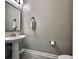 Simple, clean bathroom with pedestal sink and neutral colors at 1457 Olympic Club Blvd, Champions Gate, FL 33896