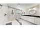 Elegant bathroom with double vanity, large shower, and marble tile at 1457 Olympic Club Blvd, Champions Gate, FL 33896