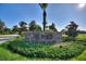 The Plaza community entrance with stonework and landscaping at 1457 Olympic Club Blvd, Champions Gate, FL 33896