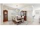 Formal dining room with a large table, chandelier, and view to the living room at 1457 Olympic Club Blvd, Champions Gate, FL 33896