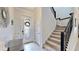 Bright entryway with tiled floors, glass door, and staircase at 1457 Olympic Club Blvd, Champions Gate, FL 33896