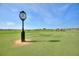 Picturesque golf course with clock tower and flag at 1457 Olympic Club Blvd, Champions Gate, FL 33896