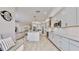 Open concept kitchen with white cabinets, island, and built in bench at 1457 Olympic Club Blvd, Champions Gate, FL 33896