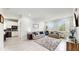 Bright living room with tile floors, comfy sofas, and kitchen views at 1457 Olympic Club Blvd, Champions Gate, FL 33896