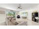 Bright living area with sectional sofa, fireplace, and wine cooler at 1457 Olympic Club Blvd, Champions Gate, FL 33896