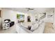 Open living space, featuring a sectional sofa and built-in electric fireplace at 1457 Olympic Club Blvd, Champions Gate, FL 33896