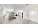 Open concept living area with sectional sofa and access to backyard at 1457 Olympic Club Blvd, Champions Gate, FL 33896