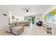 Spacious living room features a large sectional sofa, fireplace, and large TV at 1457 Olympic Club Blvd, Champions Gate, FL 33896