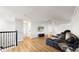 Spacious loft with hardwood floors, a sectional sofa, and a large TV at 1457 Olympic Club Blvd, Champions Gate, FL 33896
