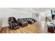 Relaxing loft area with leather sectional sofa and massage chair at 1457 Olympic Club Blvd, Champions Gate, FL 33896