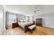 Main bedroom with wood furniture, neutral decor and a ceiling fan at 1457 Olympic Club Blvd, Champions Gate, FL 33896