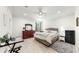 Large main bedroom with wood furniture, plenty of light and a ceiling fan at 1457 Olympic Club Blvd, Champions Gate, FL 33896