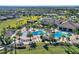 Resort-style pool with spacious deck and surrounding palm trees at 1457 Olympic Club Blvd, Champions Gate, FL 33896