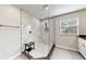 Large walk-in shower with marble walls and pebble floor at 1457 Olympic Club Blvd, Champions Gate, FL 33896