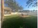 Relaxing backyard oasis with grassy area and seating at 124 Dakota Ave, Groveland, FL 34736