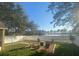 Backyard with lake view and fire pit at 124 Dakota Ave, Groveland, FL 34736