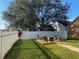 Landscaped backyard with fire pit and seating area at 124 Dakota Ave, Groveland, FL 34736