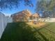 Spacious backyard with fire pit and seating area at 124 Dakota Ave, Groveland, FL 34736
