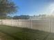 Backyard with lake view and fire pit at 124 Dakota Ave, Groveland, FL 34736
