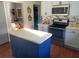 Eat-in kitchen with island and stainless steel appliances at 124 Dakota Ave, Groveland, FL 34736