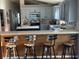 Modern kitchen with blue cabinets, an island, and wood countertops at 124 Dakota Ave, Groveland, FL 34736