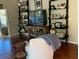 Inviting living room with built-in shelving and a cozy armchair at 124 Dakota Ave, Groveland, FL 34736