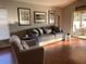 Bright and airy living room with hardwood floors and large windows at 124 Dakota Ave, Groveland, FL 34736