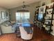 Spacious living room with hardwood floors and access to a patio at 124 Dakota Ave, Groveland, FL 34736