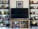Entertainment center with shelving, perfect for a large TV and media storage at 124 Dakota Ave, Groveland, FL 34736