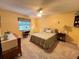 Bright bedroom with a comfy bed, ceiling fan, and ample natural light at 2488 Hartridge Point W Dr # 2488, Winter Haven, FL 33881