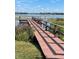 Private wooden dock extending over calm lake waters at 2488 Hartridge Point W Dr # 2488, Winter Haven, FL 33881