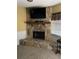 Stone fireplace with a large flat-screen TV mounted above it at 2488 Hartridge Point W Dr # 2488, Winter Haven, FL 33881