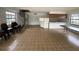 Large living room featuring a spiral staircase and kitchenette at 2488 Hartridge Point W Dr # 2488, Winter Haven, FL 33881