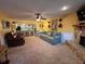Bright living room featuring a fireplace and open concept kitchen at 2488 Hartridge Point W Dr # 2488, Winter Haven, FL 33881