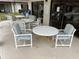 Community pool area with patio tables and chairs for relaxing at 2488 Hartridge Point W Dr # 2488, Winter Haven, FL 33881