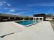 Community pool with an open-air clubhouse, offering a relaxing and social gathering space for residents at 2488 Hartridge Point W Dr # 2488, Winter Haven, FL 33881