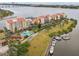 Aerial view of waterfront community with boat slips and pool at 612 Marina Point Dr # 6120, Daytona Beach, FL 32114