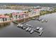 Aerial view of waterfront community with boat slips and resort-style building at 612 Marina Point Dr # 6120, Daytona Beach, FL 32114