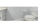 Clean bathroom with white toilet and gray vanity at 612 Marina Point Dr # 6120, Daytona Beach, FL 32114