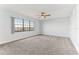 Main bedroom with large window and carpet flooring at 612 Marina Point Dr # 6120, Daytona Beach, FL 32114