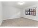 Spacious bedroom with gray carpeting and large window at 612 Marina Point Dr # 6120, Daytona Beach, FL 32114