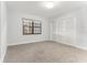 Bright bedroom with window, closet, and gray carpet at 612 Marina Point Dr # 6120, Daytona Beach, FL 32114