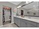 Primary bathroom with double vanity and large mirror at 688 Orange Belt Loop, Winter Garden, FL 34787