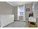 Bedroom with white dresser, workspace, and window with blinds at 688 Orange Belt Loop, Winter Garden, FL 34787