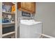 Laundry room with washer, dryer, and built-in shelving at 688 Orange Belt Loop, Winter Garden, FL 34787