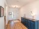 Bright entryway with wood flooring and navy blue console table at 7865 Sw 89Th Cir, Ocala, FL 34481